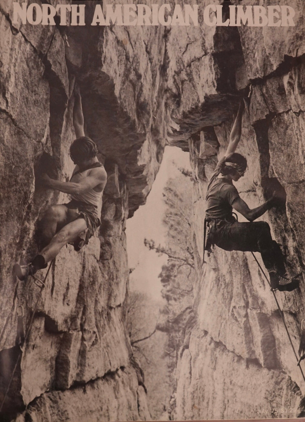 Two climbers on a rocky cliff face with 'North American Climber' text at the top.