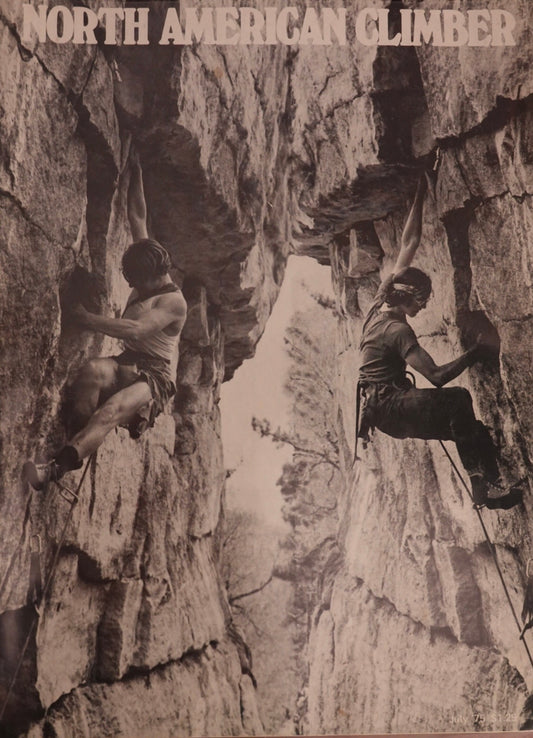 Two climbers on a rocky cliff face with 'North American Climber' text at the top.